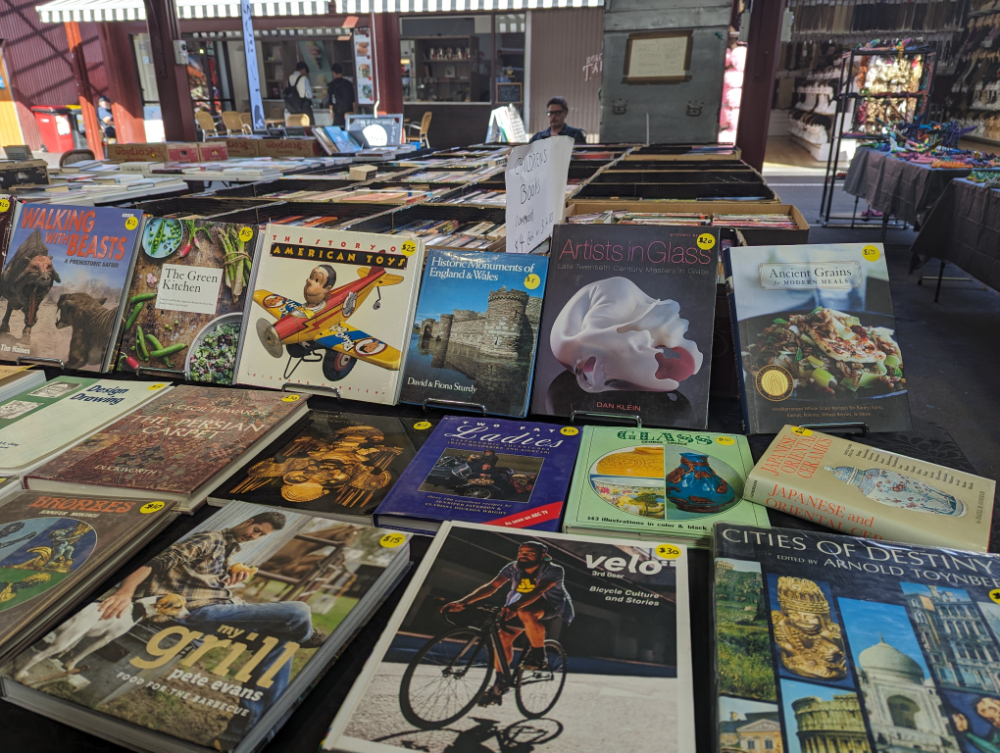 Piles of books at the Melbourne Book Market at Queen Victoria Market