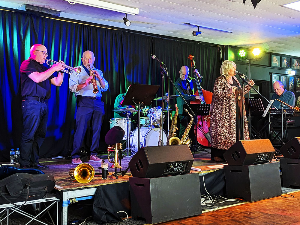 Jazz musicians performing on stage at Newport Bowls Club