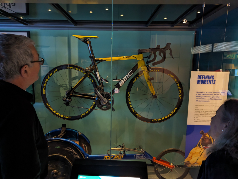 Admiring Cadel Evans bike, mcg tours and sports museum