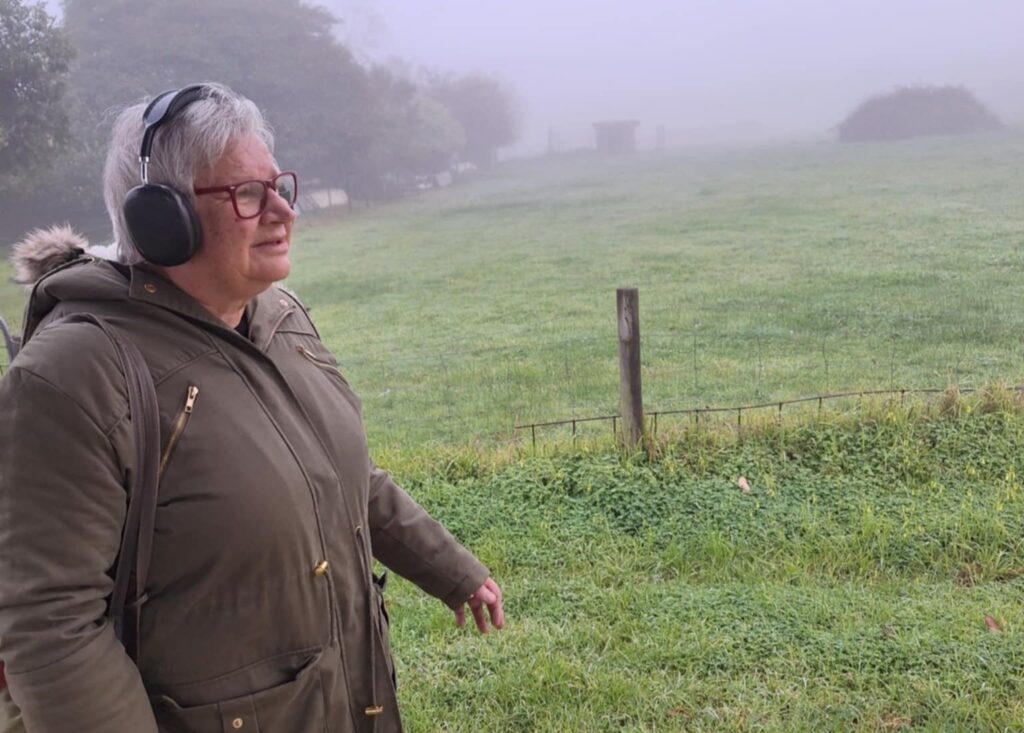 woman walking and listening to a Melbourne podcast