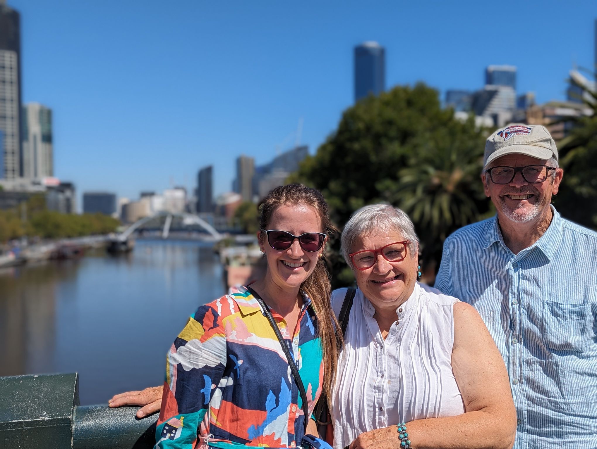 Three people standing by the Yarra river for Father's Day Melbourne