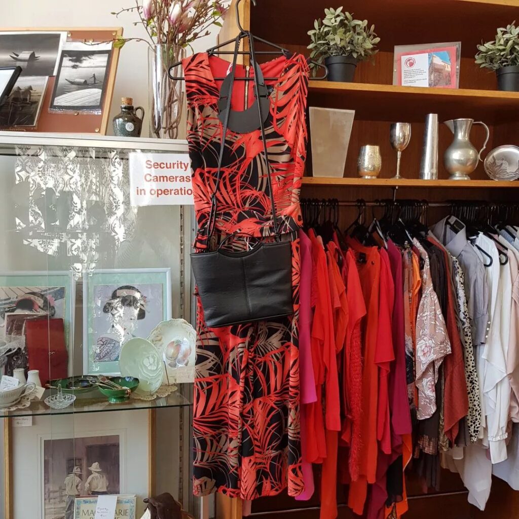 red outfits on display at Community Chest Op Shop