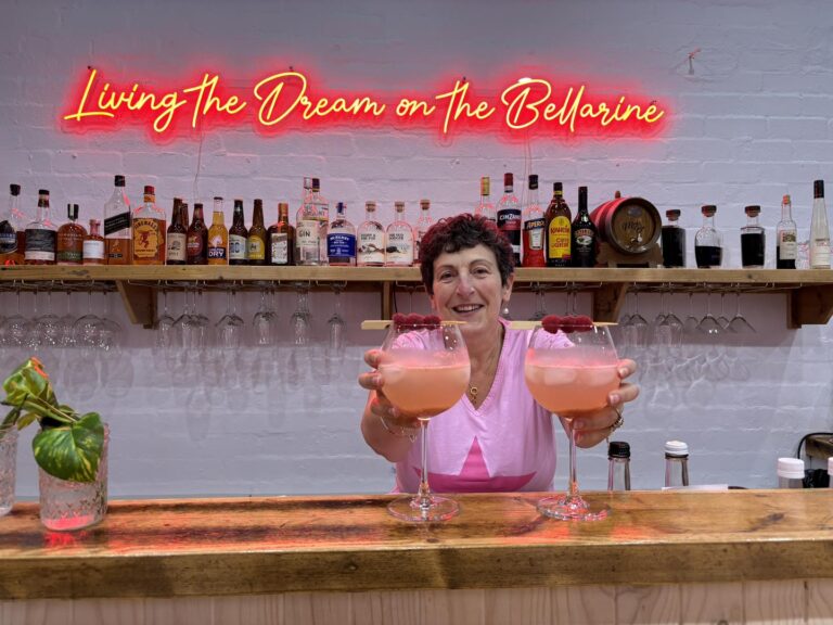 A lady presenting a drink at Marli's Bar - regional Victoria events Seniors Festival