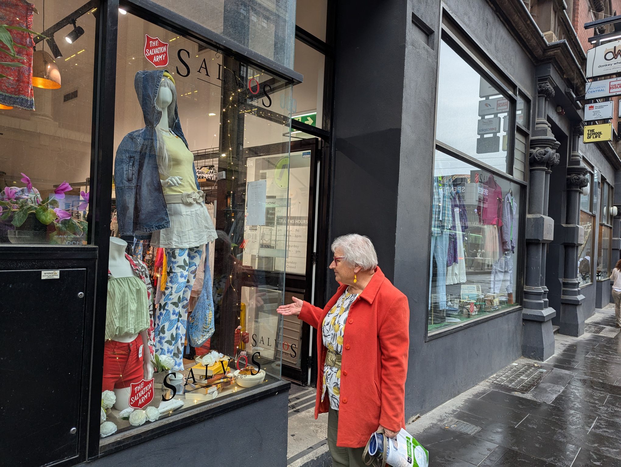 A lady stands outside an op shop for an article about the Best op shops melbourne