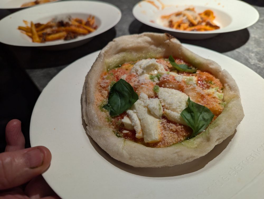 Tasty gnocchi inside a pizza base bowl