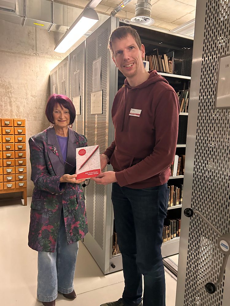 Carmel presenting her book to the Director of Stenographic Services, Saxony University Library 