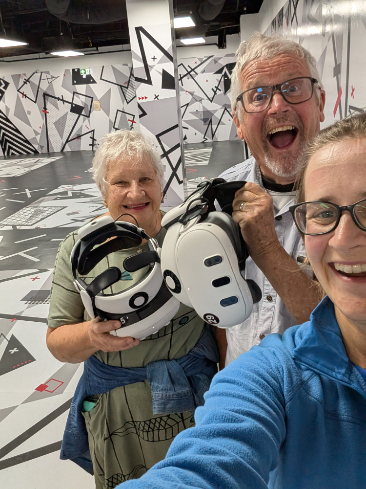 Big smiles with the VR headsets of their faces